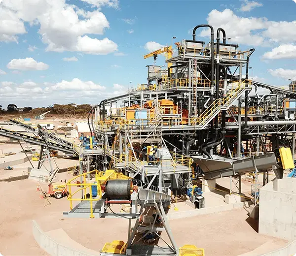 Mining and processing plant facility under construction with equipment and conveyors