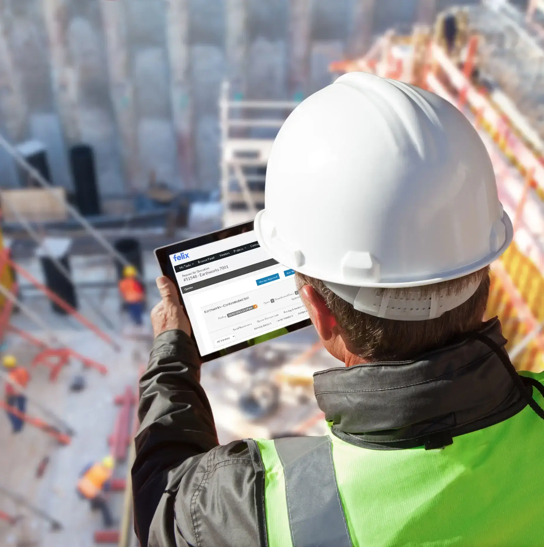 Construction manager using Felix platform on tablet at building site