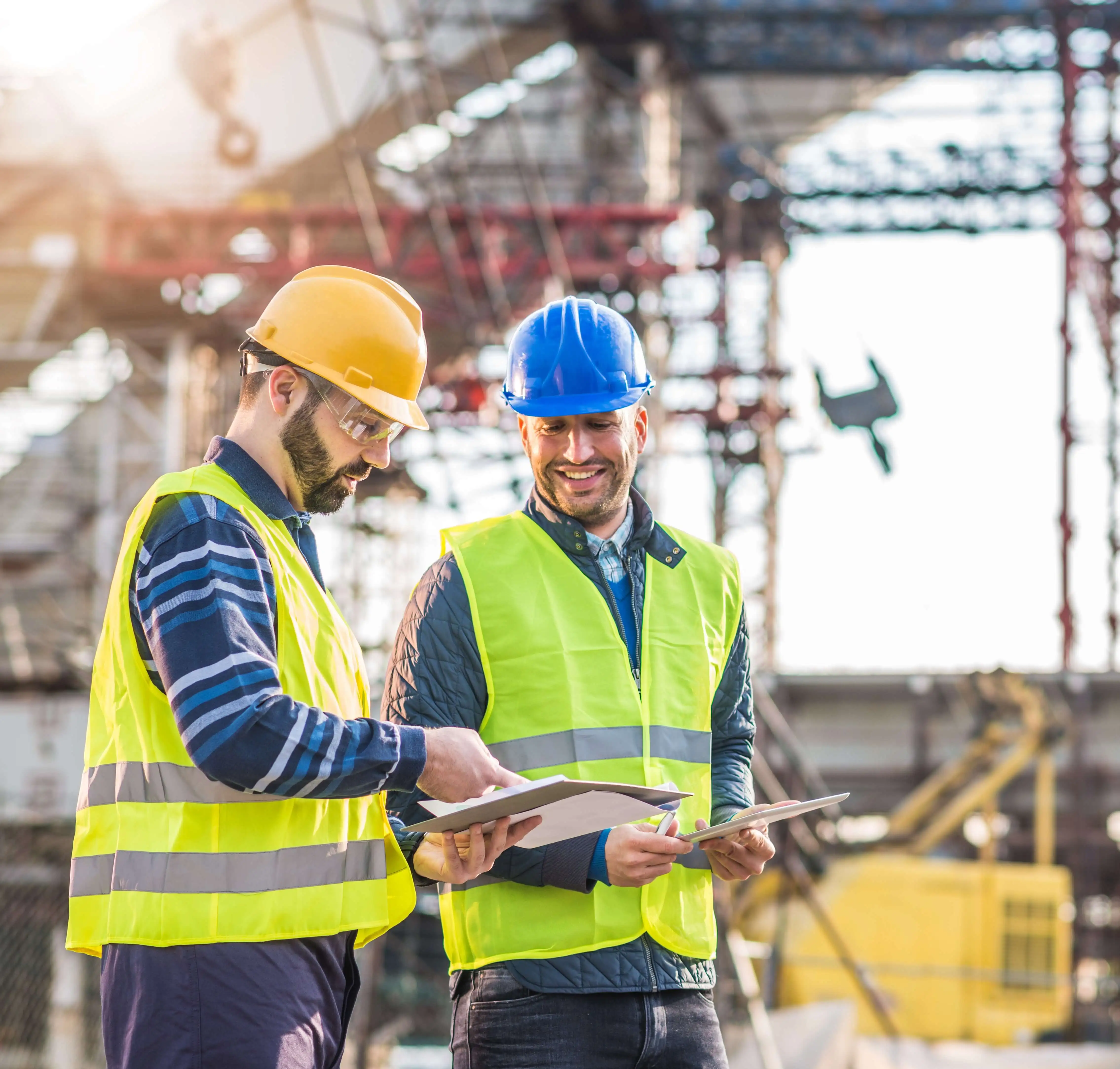 Construction managers reviewing smart contract storage plans on-site