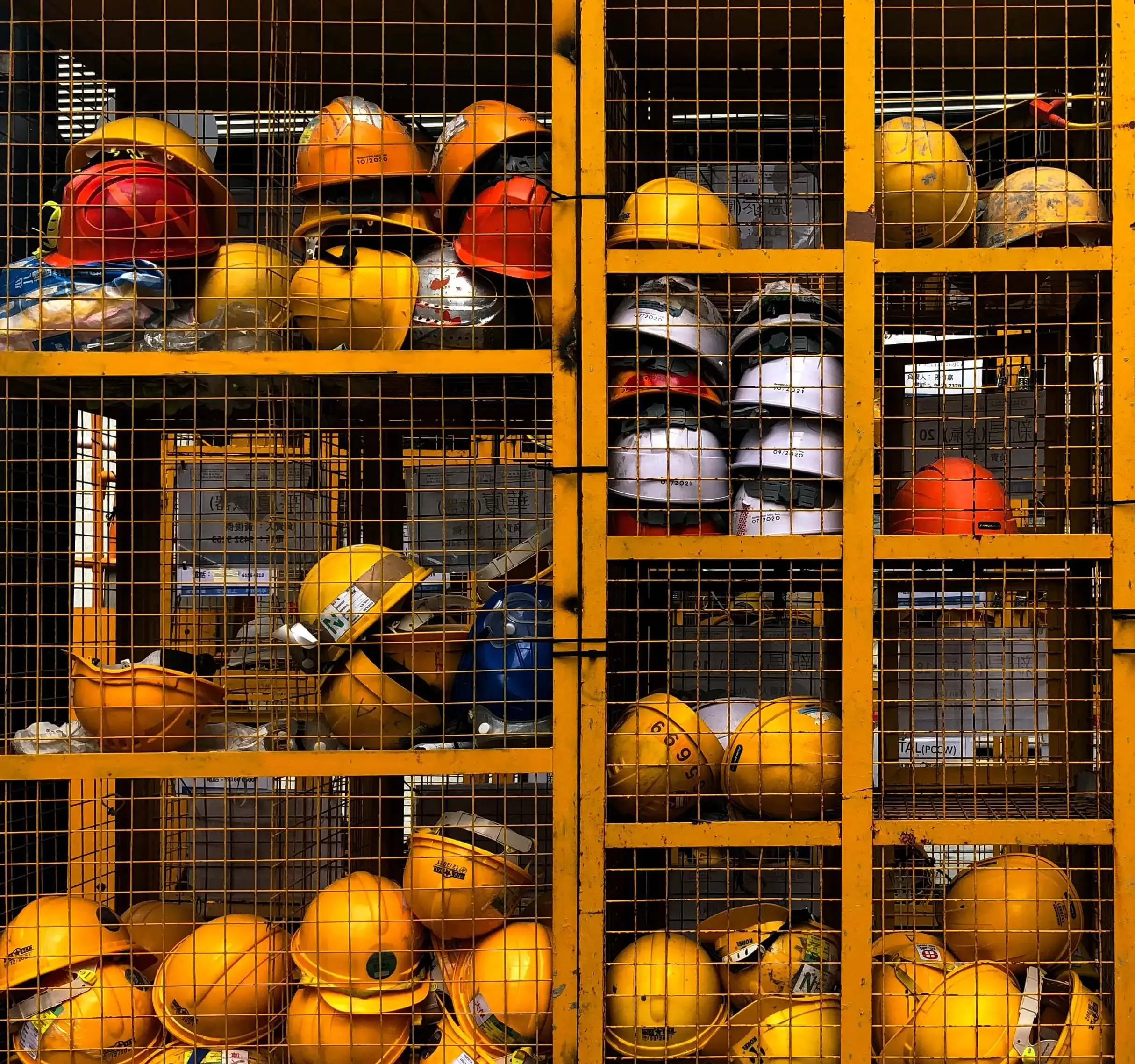 Storage rack with construction helmets and smart contract labeling